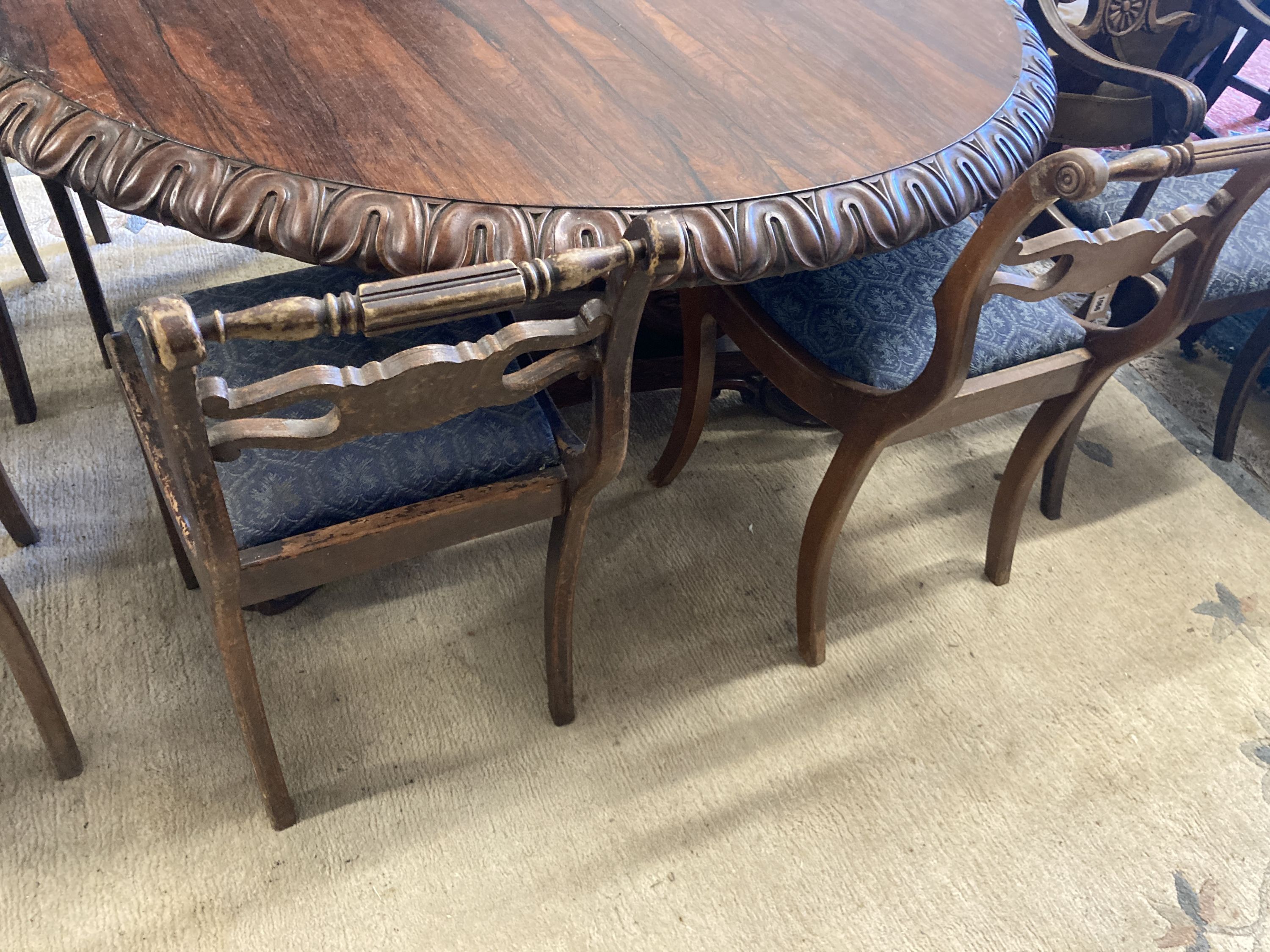 A set of eight Regency style beech dining chairs, two with arms